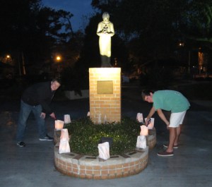 After luminaria bags are placed around campus, the candles are lit at dusk.