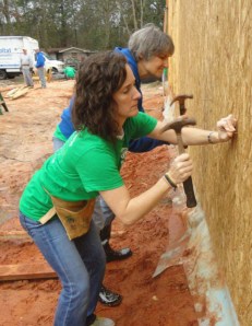 Senior Guidance Counselor Renee Miller and Chemistry Teacher Jan Gardner hon their hammering skills.