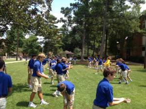 The new eighth graders enjoy a nice game of water balloon toss at the Five Core Rally.