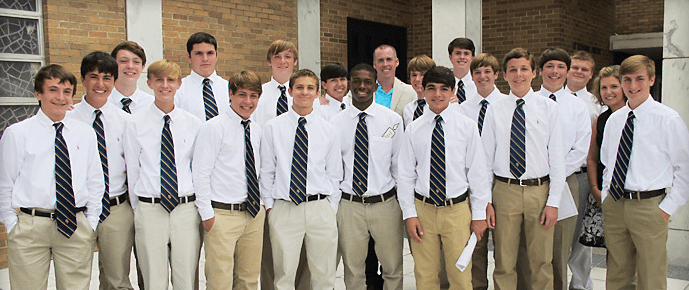 Students posing in their dress uniform shirts and ties.