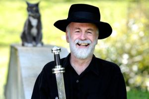 Sir Terry Pratchett wields his very own hand-forged meteorite sword. 