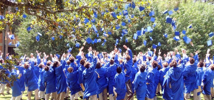 Graduates from the class of 2014 toss their caps in the air following the graduation ceremony. (photo courtesy SPS FaceBook page)