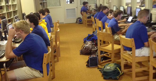 Criminology students create PowerPoint presentations on schools of thought on crime in the St. Paul's School library during a recent Criminology class. (photo by Adam Satterlee)