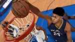 Anthony Davis, star Power Forward for the New Orleans Pelicans, goes for a slam dunk in NBA 2K15. (Photo Credit: Operation Sports ©2K Sports)