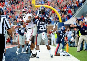 Ole Miss Rebel players celebrating Senquez Golson's interception to seal the Rebel victory. (Photo Credit: USA Today Sports) 