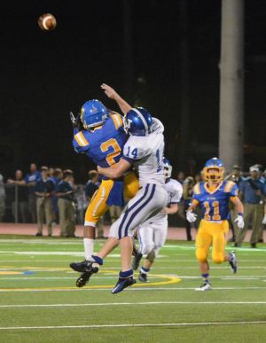 Wide Receiver Jalen McCleskey attempts a catch on a crucial drive against now-State Champion Jesuit, but is thwarted by a defender who tackles him mid-air, prior to the catch, with no flags thrown. (Photo Credit: Chase Whittington)