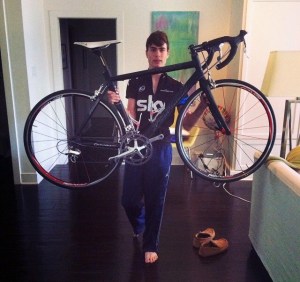 Rusty shows off his bike prior to his accident. He anxiously awaits his return to cycling. (photo courtesy Zac Russ)