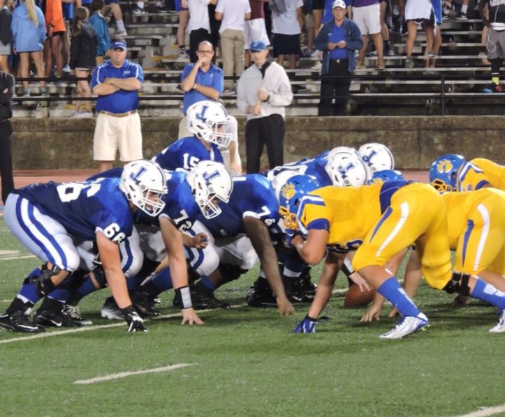 Jesuit senior quarterback, Peter Hontas, waits for the snap during an offensive drive.