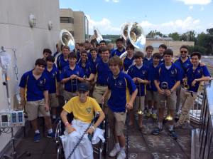 Members of the Marching Wolves visit Junior Drum Major Ruston Keller at Ochsner Hospital over the summer. The band performed for Ruston in a show of support for his second surgery to take place the following day. He has since had a third surgery and has one more left to go. (photo courtesy Marching Wolves)