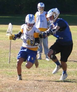 Freshman Chris Flood runs a drill with junior Patrick Flynn.