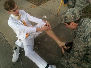 Dustin Simoneaux gets his twisted ankle serviced during a Mardi Gras parade. (Photo by Christi Simoneaux)