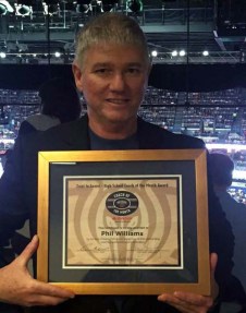 Head coach Phil Williams receiving an award from the Pelicans for coach of the month (courtesy of the SPS basketball twitter page) 