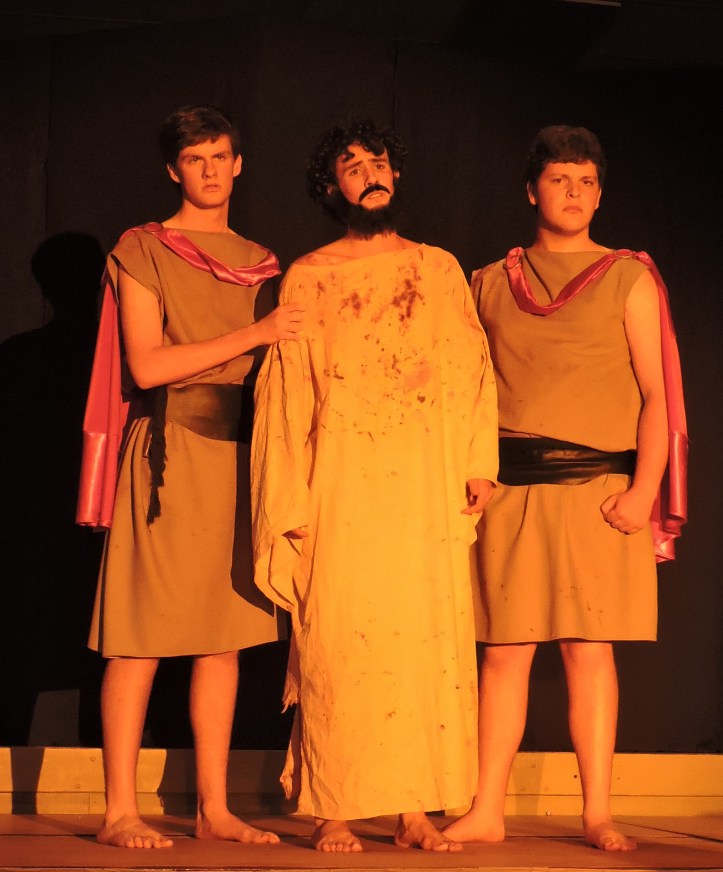 Jesus prepares to be scourged by Roman Soldiers.