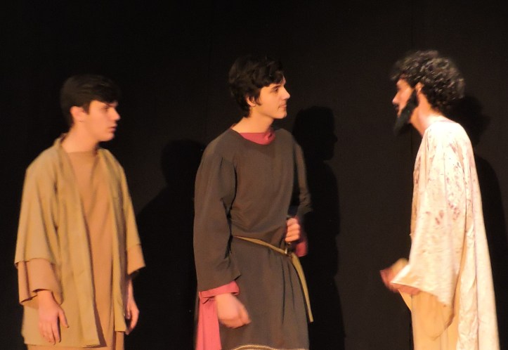 Jesus (Spenser Albright) converses with his disciples (Addison Nick and Shane Davies) after praying in the garden.