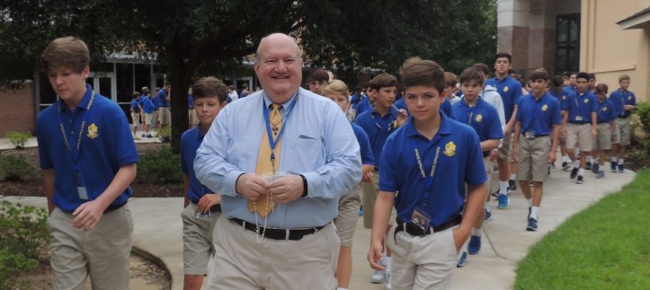Bro. Ken Boesch, FSC leads a pack of Wolf Pups into their first President's Assembly on Thursday, Aug. 11, 2016. (photo: Mimi Monteiro)