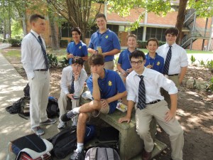 A group of freshmen enjoy their first lunch of the year in their spot between Benilde and Lasalle Halls.