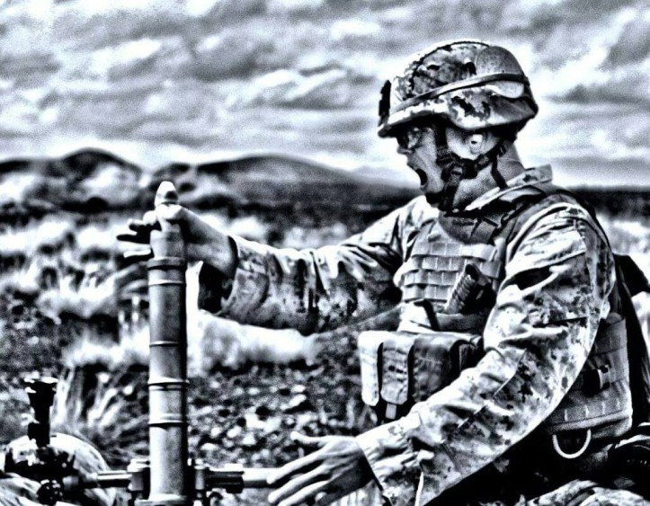 Cpl. Brennan Mckey yells "hanging" as he prepares to launch a mortar. The announcement alerts mortar squad of an impending launch. (photo courtesy Brennan Mckey)