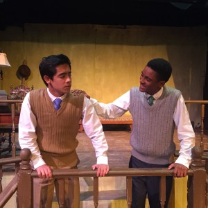 Ed (Luke Vargas) and Mr. De Pinna (Justin McClesky) discuss a suspicious man who has been following Ed.