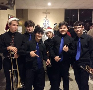 Members of the Jazz Band enjoy the reception following their concert in the cafeteria. (Photo by Lester Guttuso)